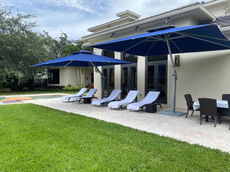 Spend The Day Poolside Under An Umbrella 